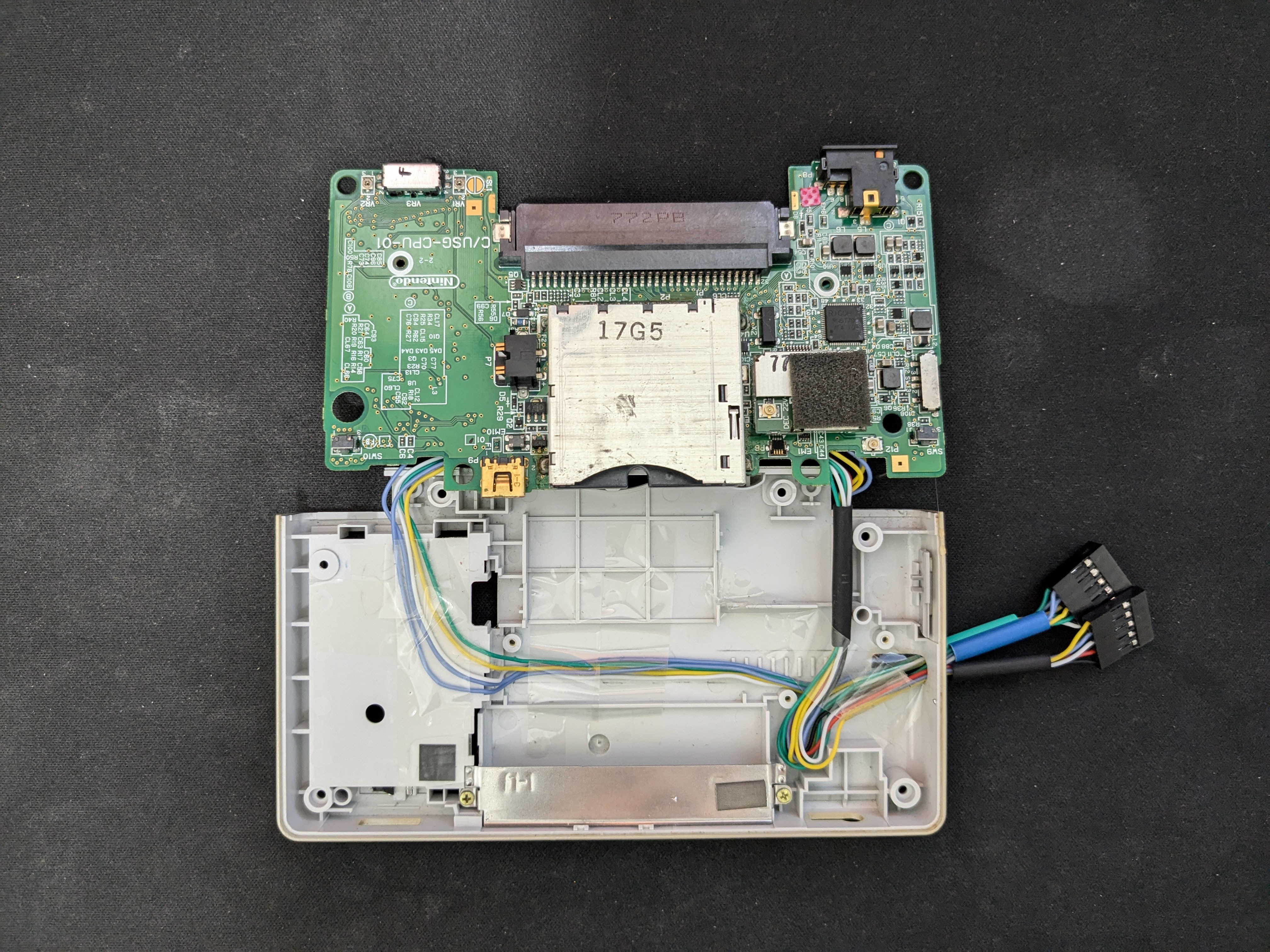 Wires routed inside the DS shell toward the stylus compartment
